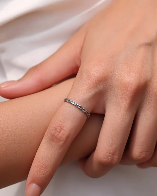Wheat Ring in 925 Sterling Silver - worn on a model’s finger, close-up