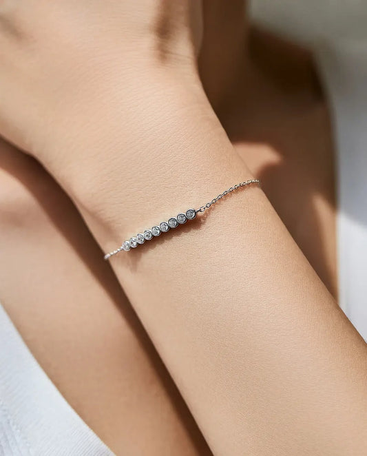 Dainty moissanite station bracelet, 9 round D color stones, 925 sterling silver