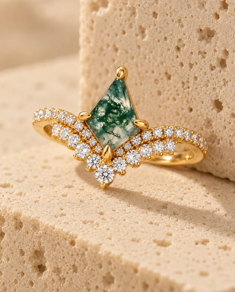 Kite Moss Agate Ring - displayed on a travertine block
