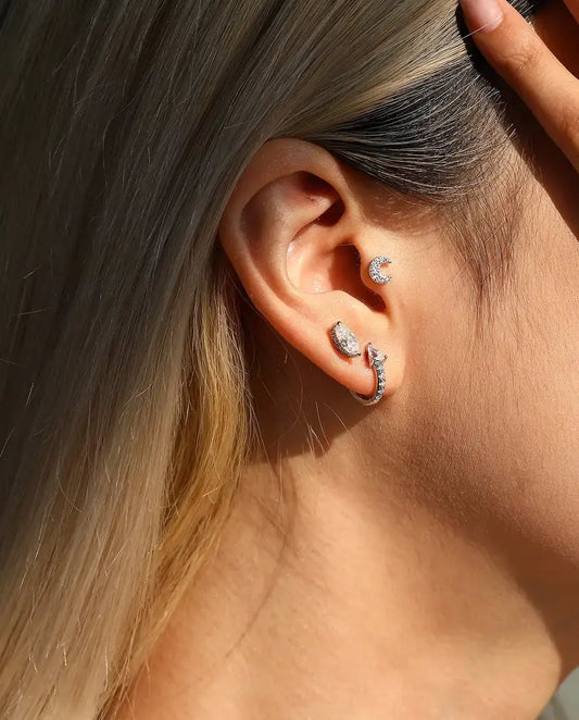 Marquise Moissanite Stud Earrings in 925 Sterling Silver - worn in the ear, close-up