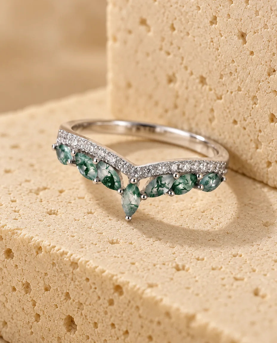 Marquise Moss Agate Chevron Ring - displayed on a travertine block