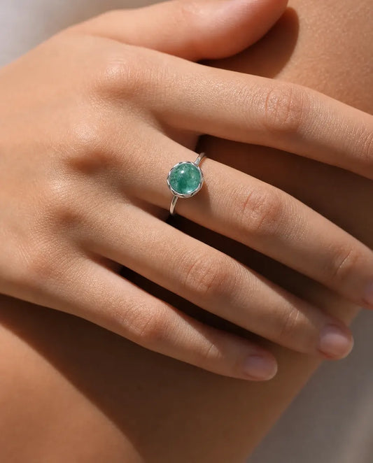 Moss agate round cabochon adjustable ring in sterling silver with sunburst bezel and thin dainty band