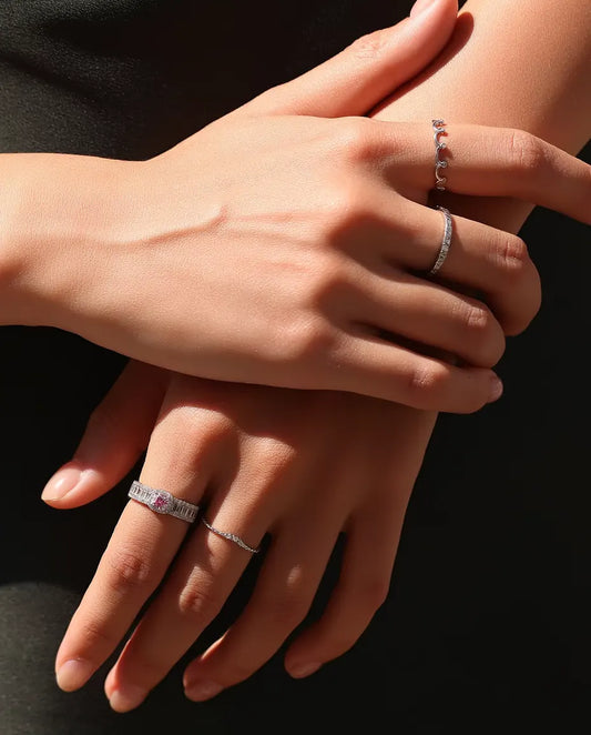 Moissanite Stacking Ring in 925 Sterling Silver - worn together with other rings, hands resting on each other