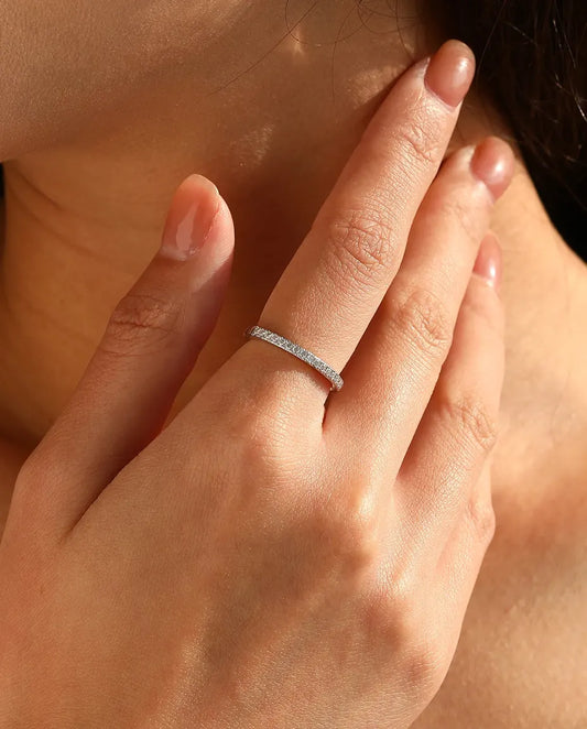 Pavé moissanite wedding band in 925 sterling silver with round D color stones