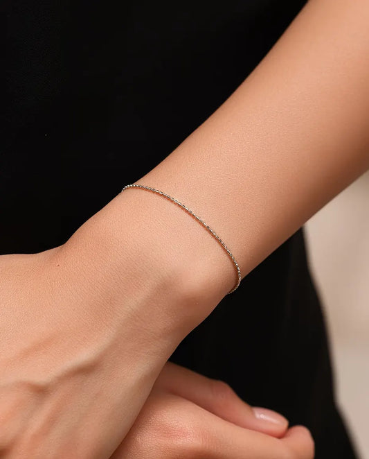 Sparkle Chain Bracelet in 925 Sterling Silver - worn on the wrist, hands clasped together