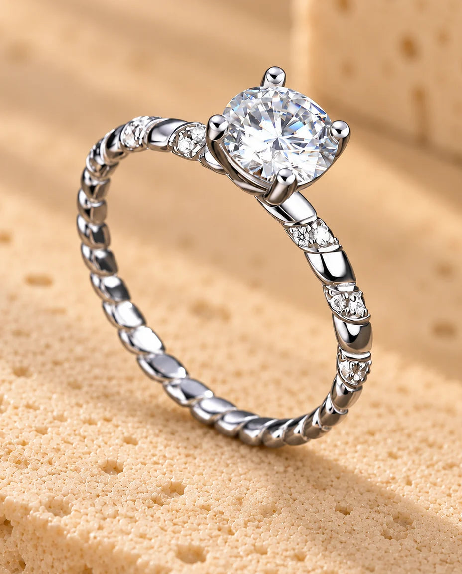 Twisted Moissanite Solitaire Ring - displayed on a travertine block
