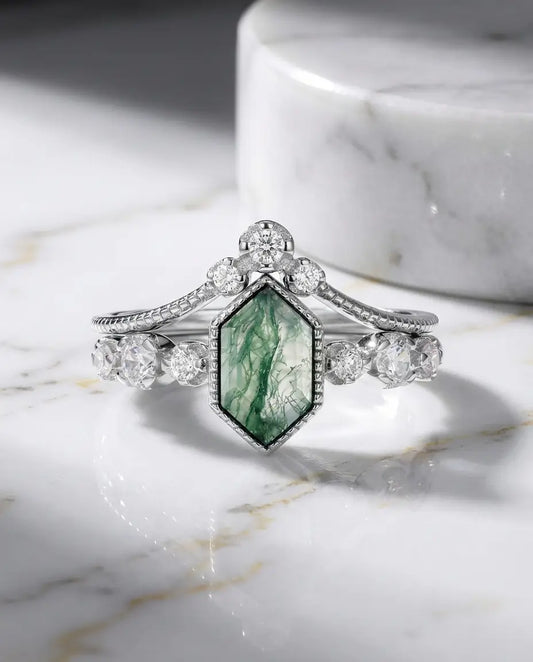 Statement cushion cut moss agate ring in 925 sterling silver being cared for