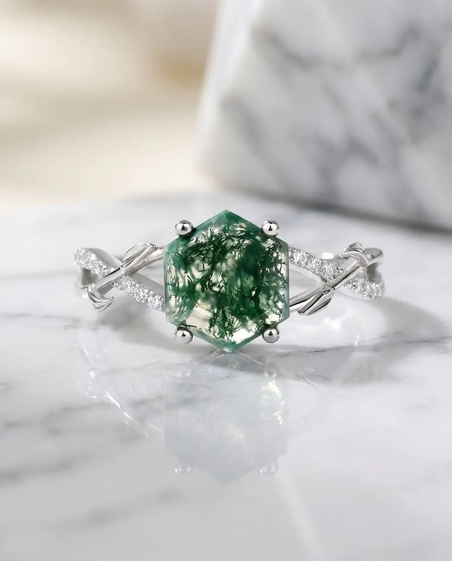 High-quality kite-cut moss agate ring in sterling silver showing clear green dendritic inclusions