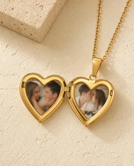 Heart photo locket open to show the two heart-shaped photos held inside