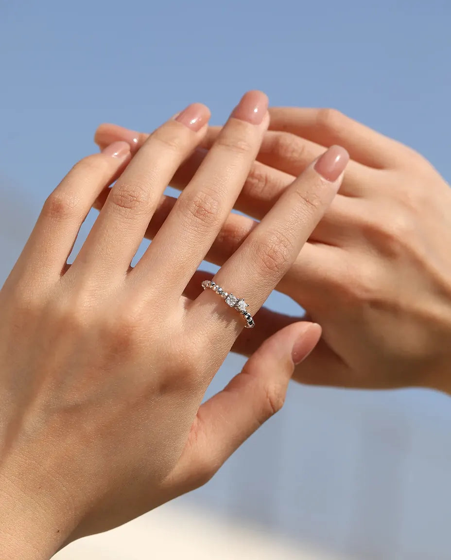 Adjustable beaded moissanite ring in 925 sterling silver with two round D color stones