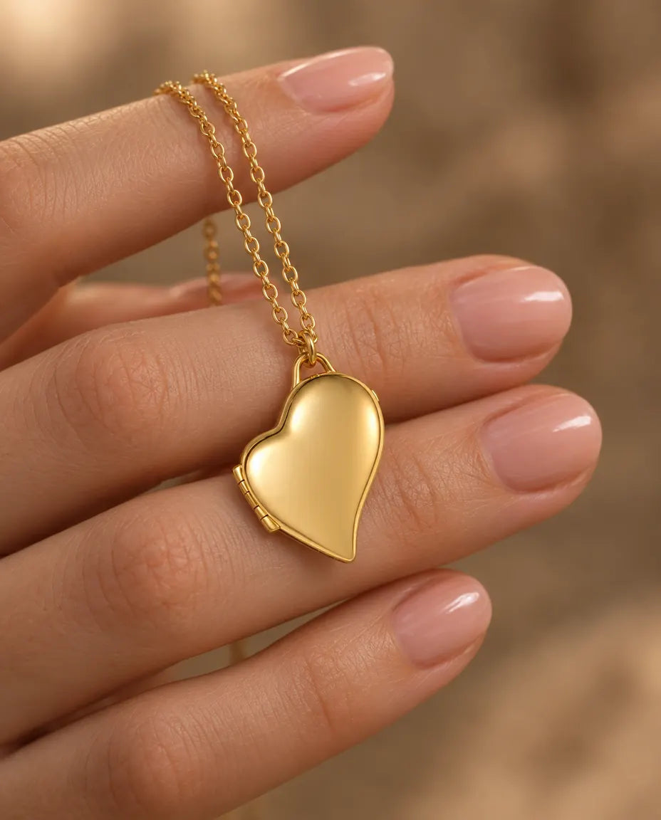 Personalized Asymmetric Heart Photo Locket Necklace That Holds 2 Pictures held in hand