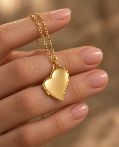 Personalized Asymmetric Heart Photo Locket Necklace That Holds 2 Pictures held in hand