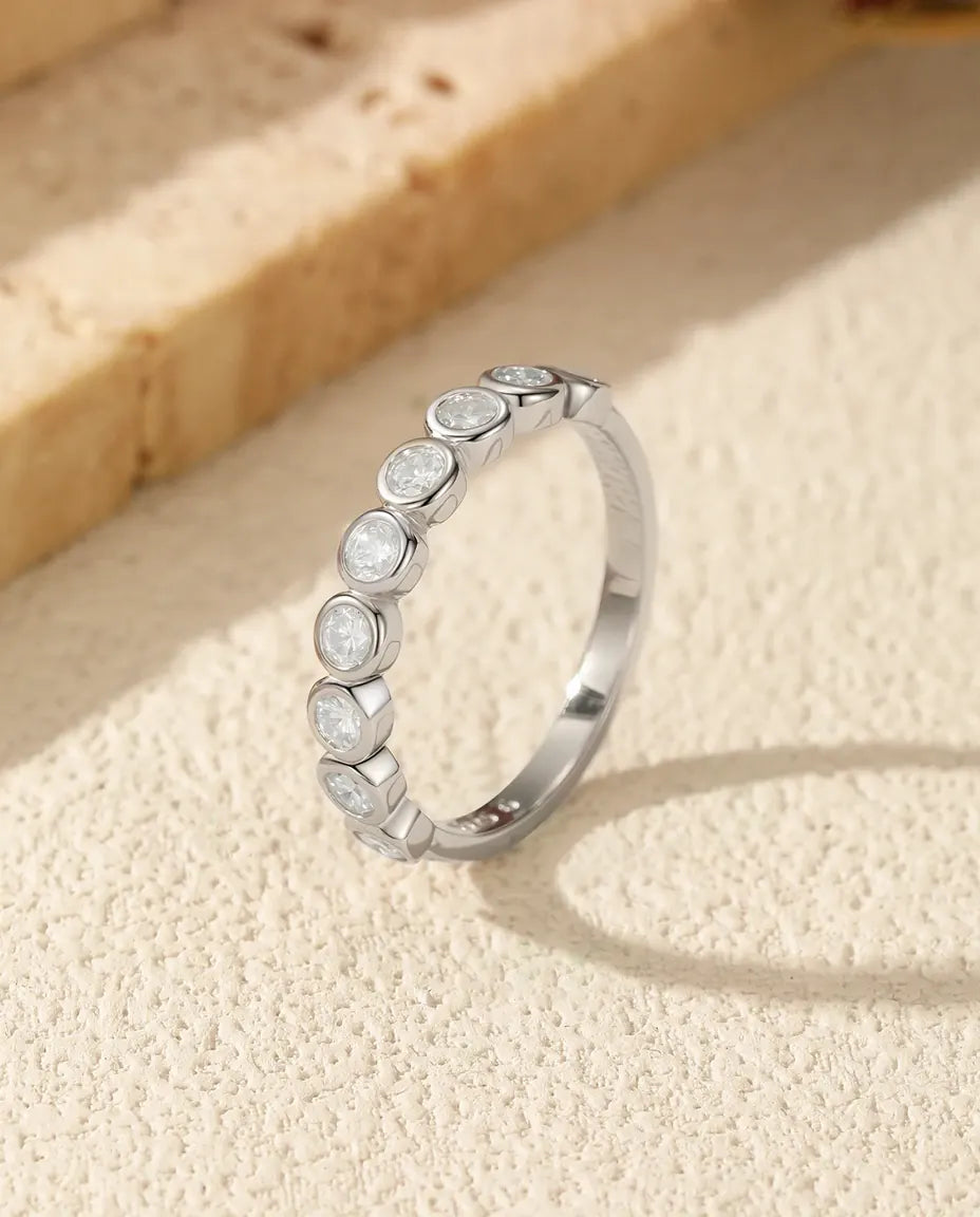 Bezel-set moissanite eternity ring in 925 sterling silver, bubble band
