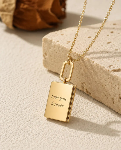 Back of the gold book locket engraved with love you forever