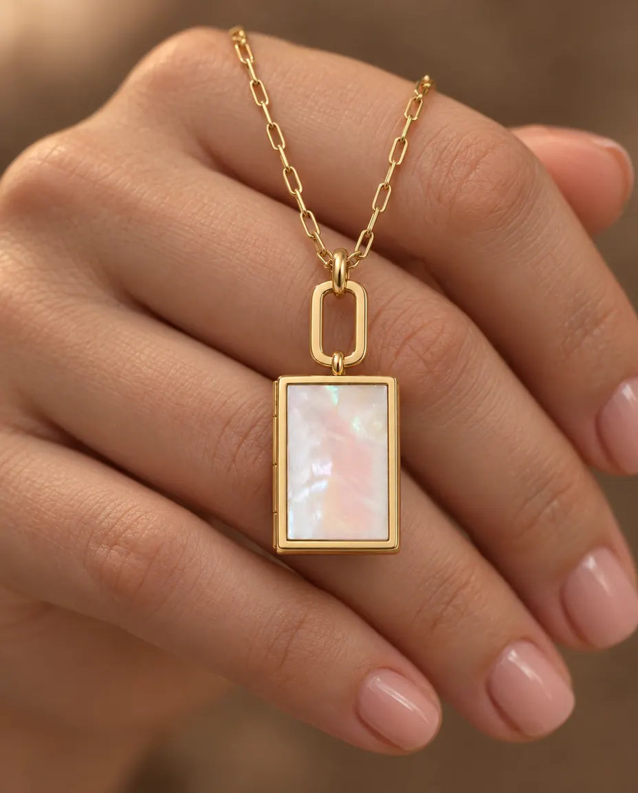 Personalized Book Photo Locket Necklace That Holds 2 Pictures held in hand