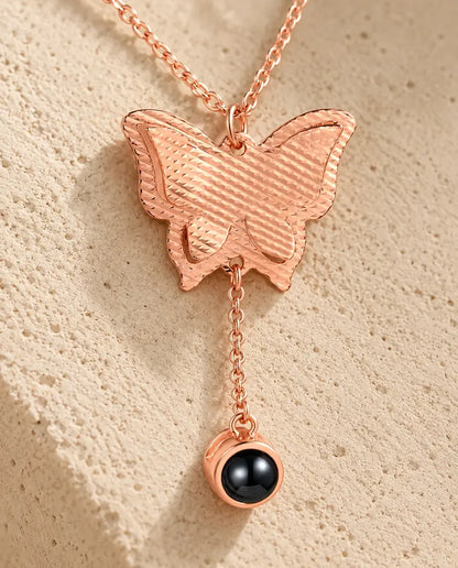 Personalized Butterfly Photo Projection Necklace - close-up of the projection charm