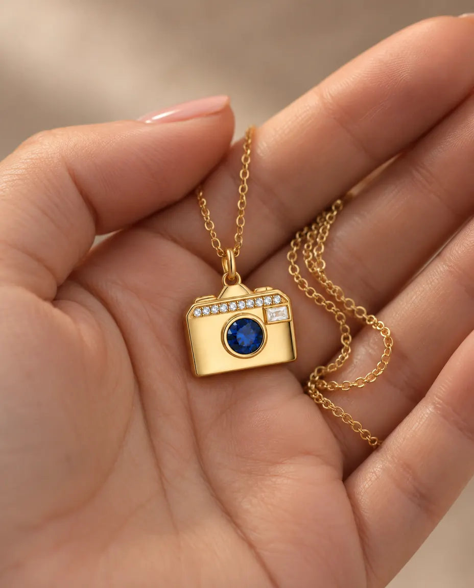 Personalized Camera Photo Locket Necklace That Holds 2 Pictures held in hand