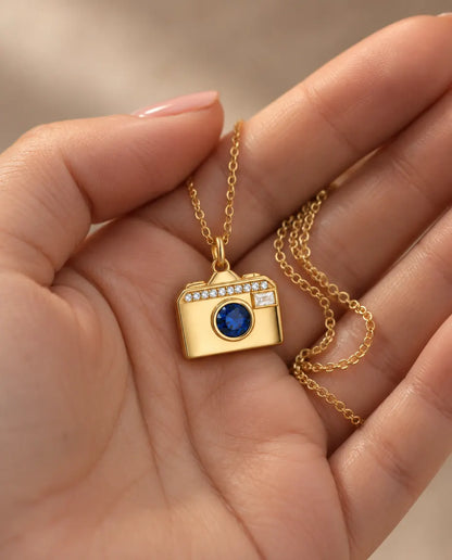 Personalized Camera Photo Locket Necklace That Holds 2 Pictures held in hand