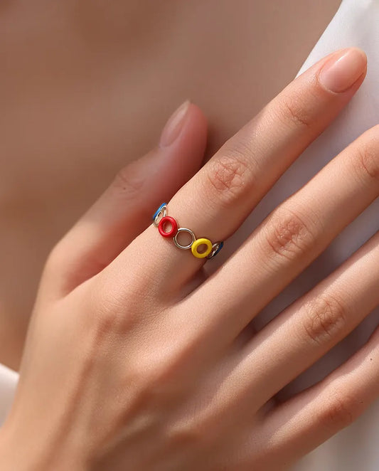 Enamel Circle Ring in 925 Sterling Silver - worn on a hand resting near the collarbone