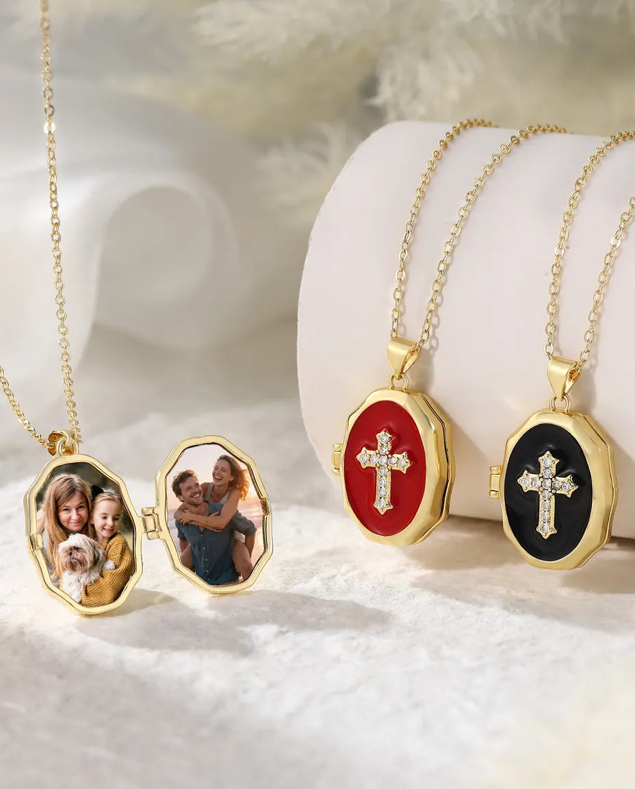 Cross photo locket necklace collection showing open locket and three enamel colors