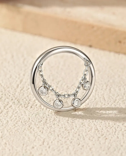 Sterling silver charm ring with draped chain and bezel set cubic zirconia drops