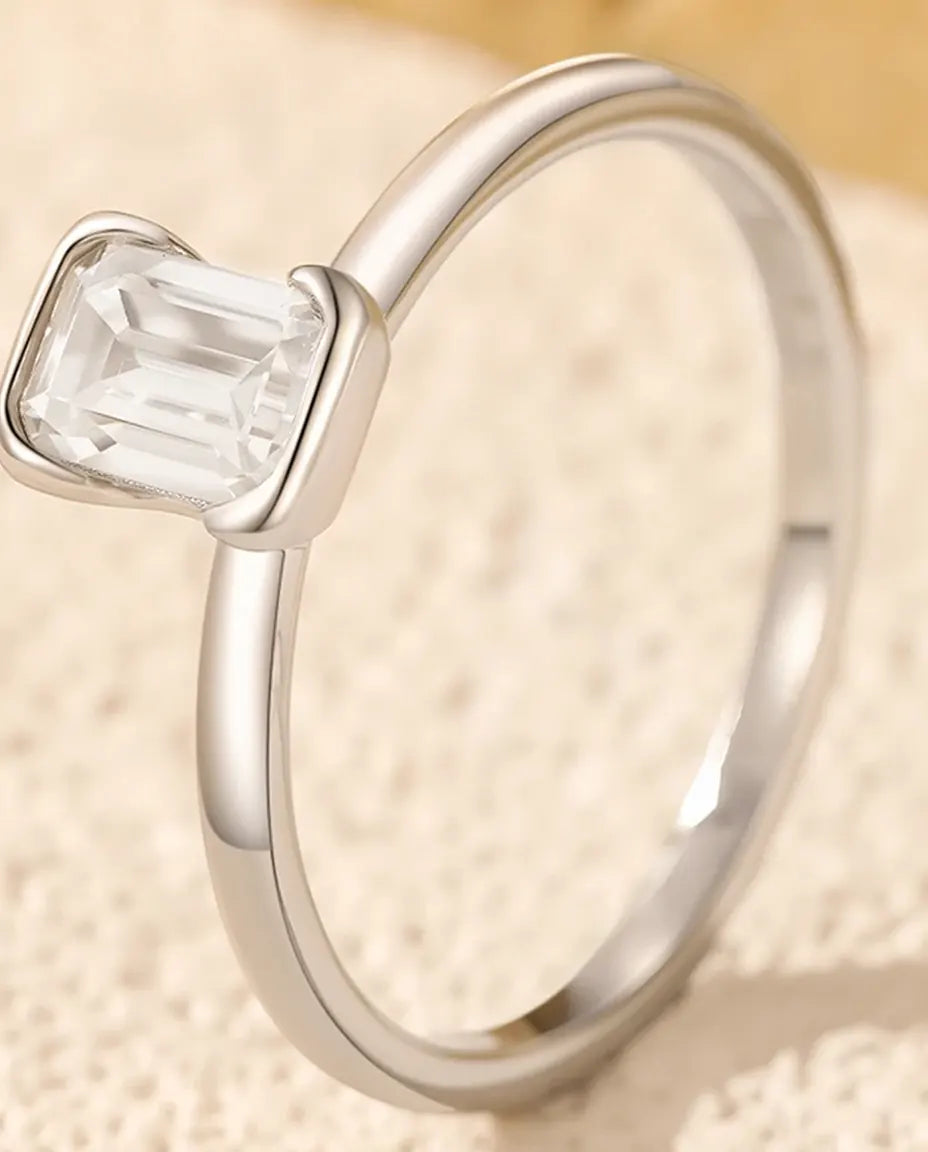 Emerald cut moissanite engagement ring in 925 sterling silver