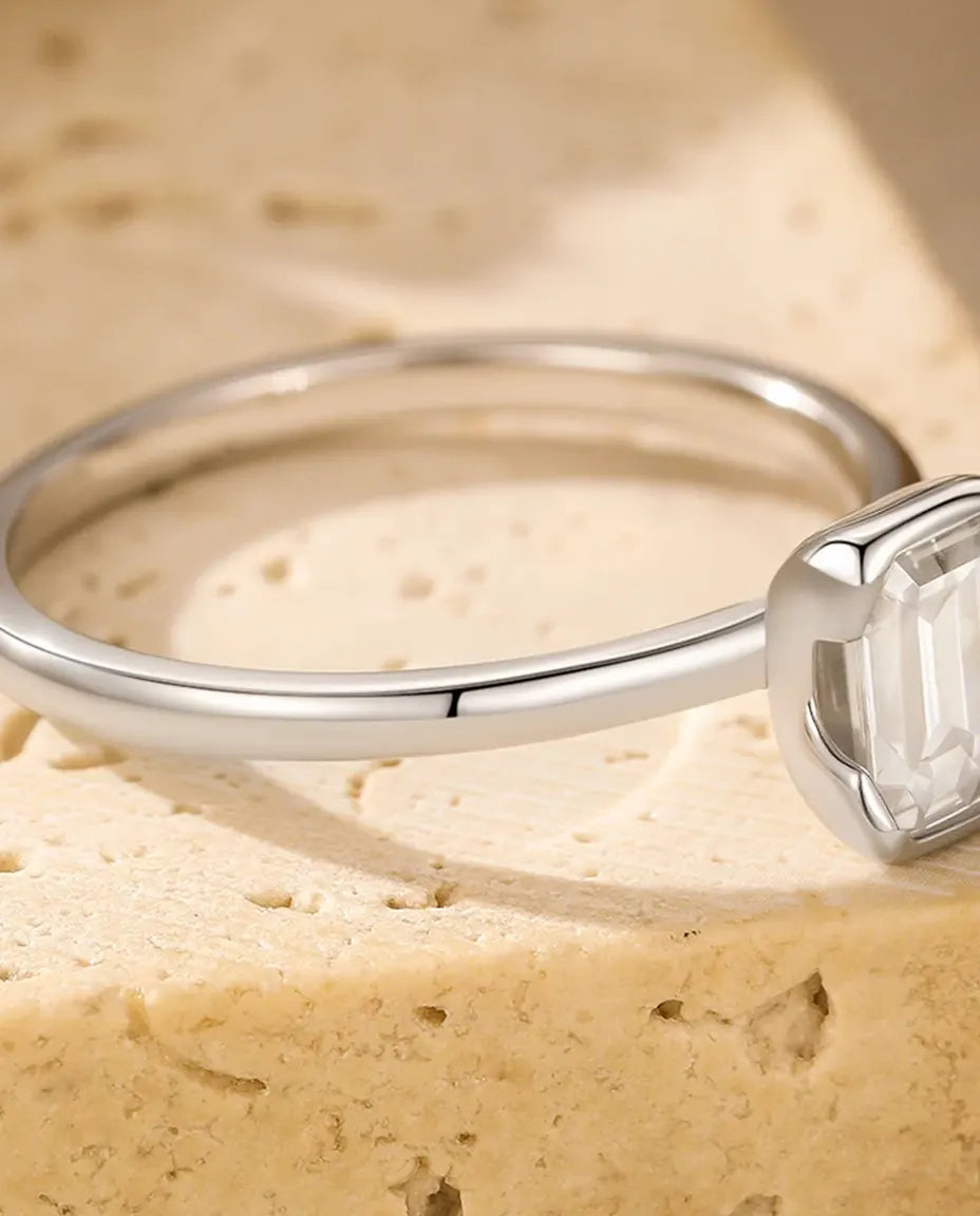 Emerald cut moissanite engagement ring in 925 sterling silver