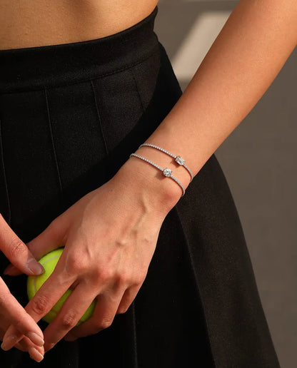 emerald cut moissanite tennis bracelet in 925 sterling silver on a wrist