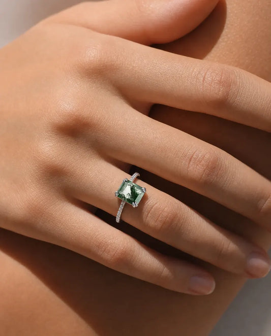 Emerald-cut moss agate pave solitaire ring in sterling silver with double-claw prongs and pave band