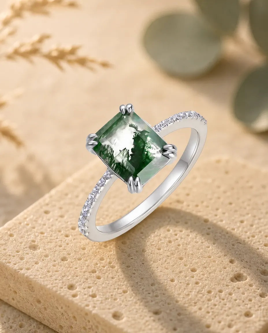 Emerald-cut moss agate pave solitaire ring in sterling silver with double-claw prongs and pave band
