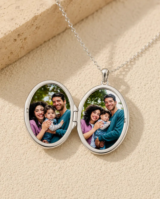 Oval photo locket necklace opened to show the two photos inside