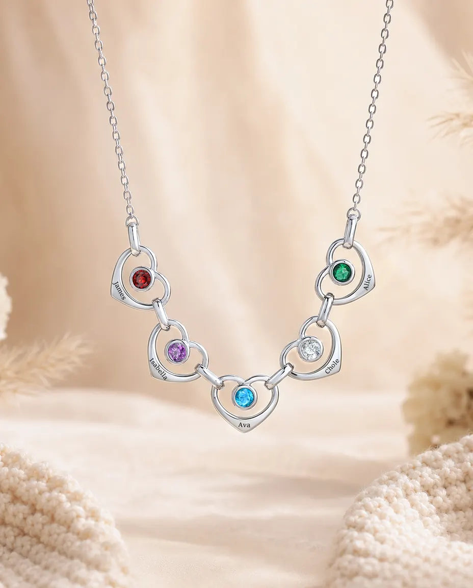 Silver family birthstone necklace with five linked hearts and engraved names