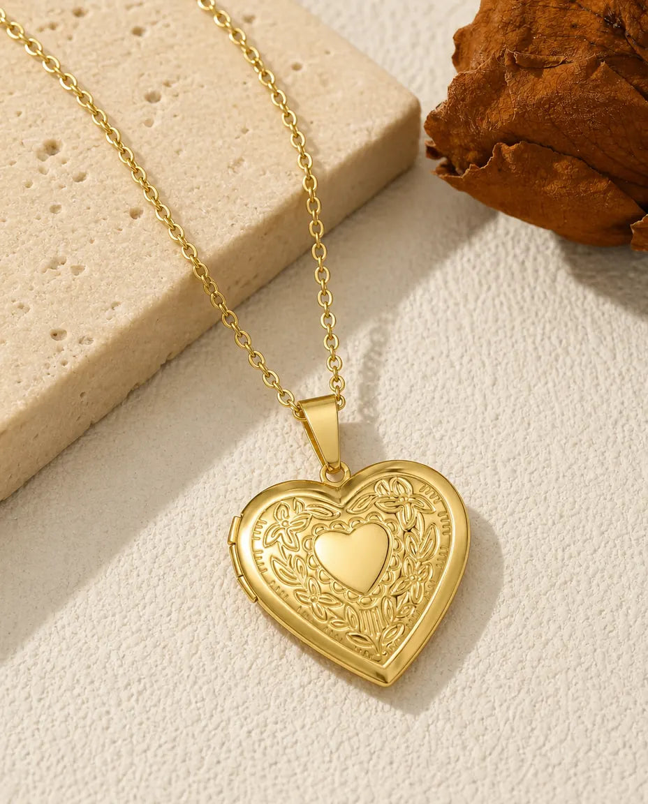 Gold floral heart photo locket necklace with embossed heart and flower front