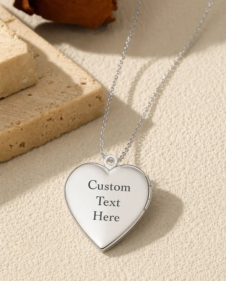 Smooth polished back of heart locket engraved with custom text sample