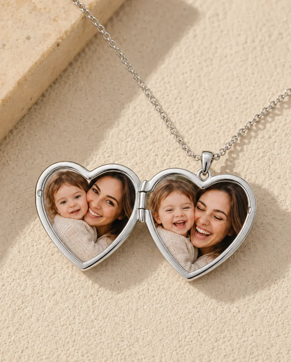 Heart photo locket necklace opened to show the two photos inside