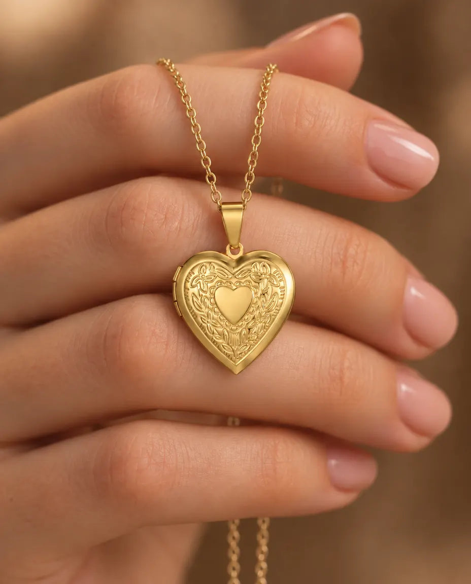 Personalized Floral Heart Locket Necklace That Holds 2 Photos with Custom Back Engraving held in hand