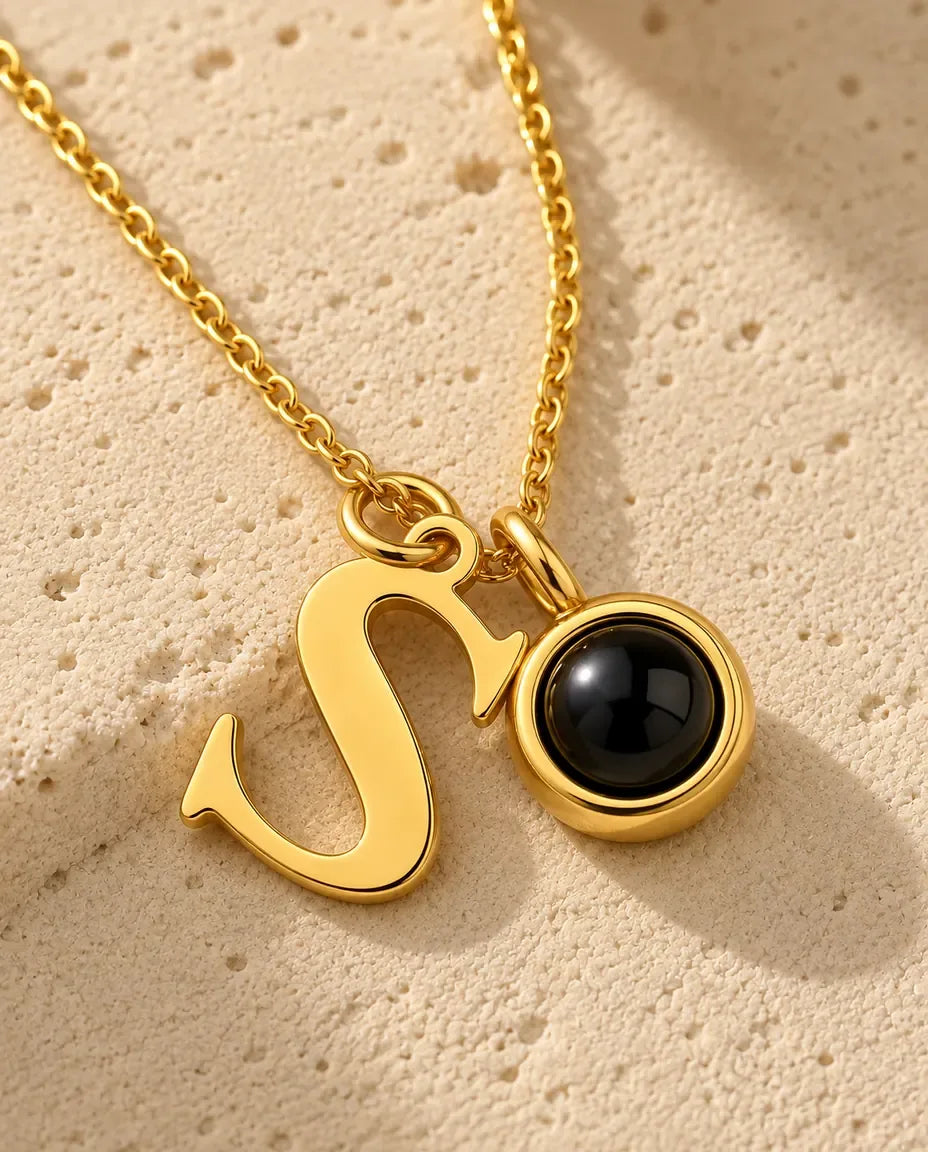 Personalized Initial Photo Projection Necklace in Gold - close-up of the projection pendant