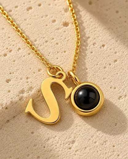Personalized Initial Photo Projection Necklace in Gold - close-up of the projection pendant