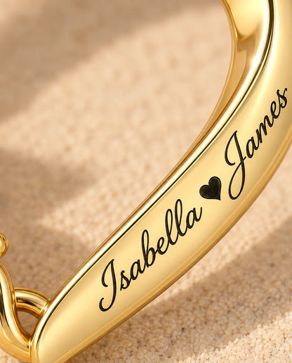 Macro detail of the two names engraved along the polished gold band