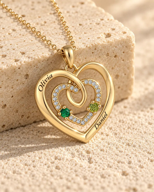 Close-up of the three nested hearts with a pave middle heart and two birthstones