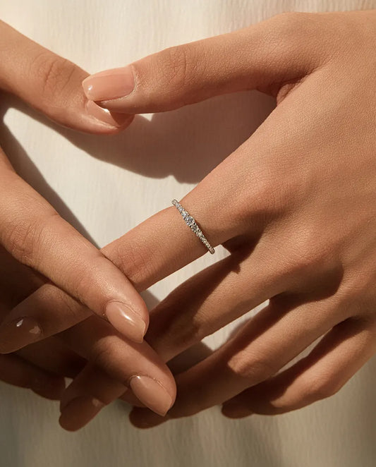 Graduated moissanite wedding band in 925 sterling silver with 19 round D color stones