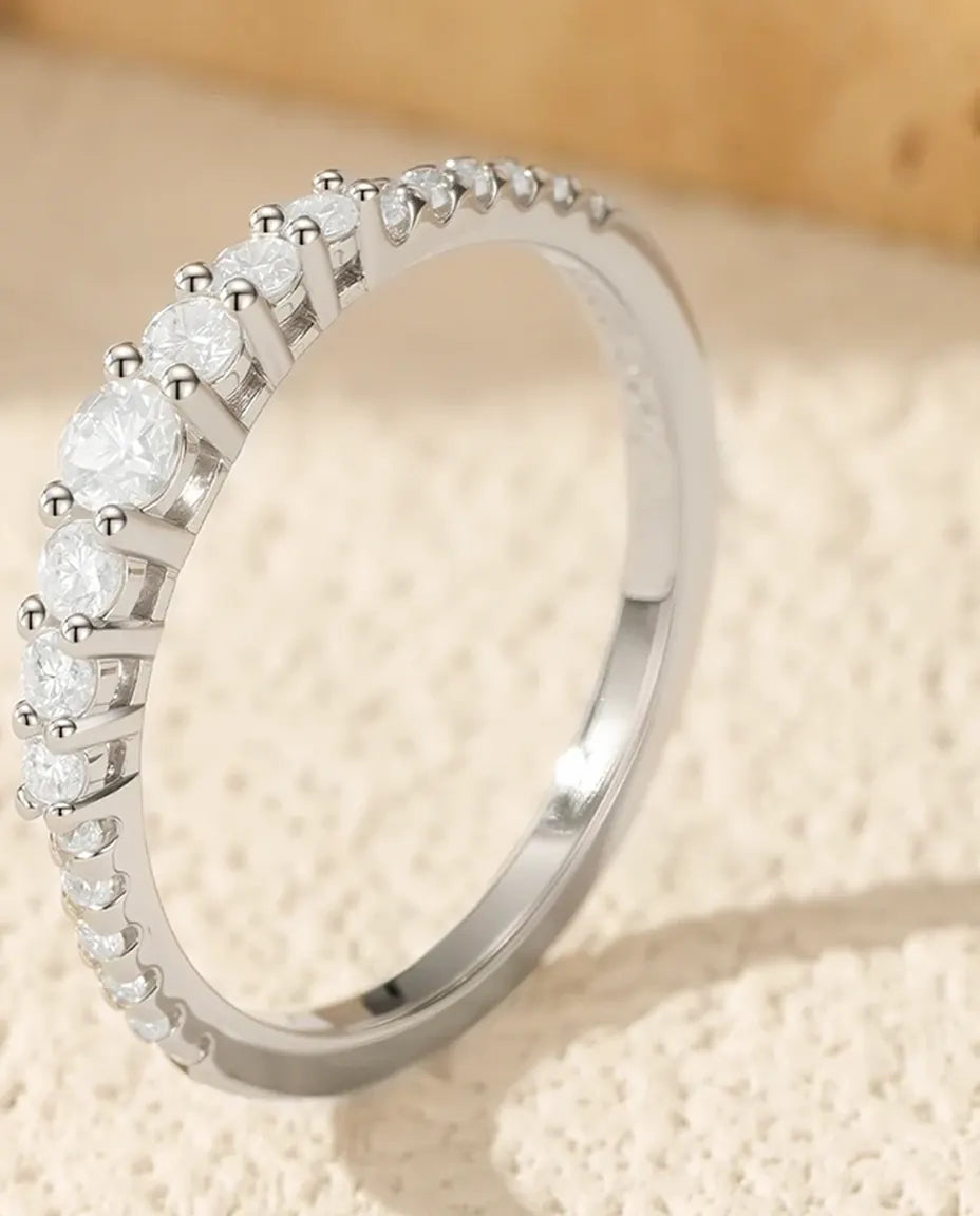 Graduated moissanite wedding band in 925 sterling silver with 19 round D color stones