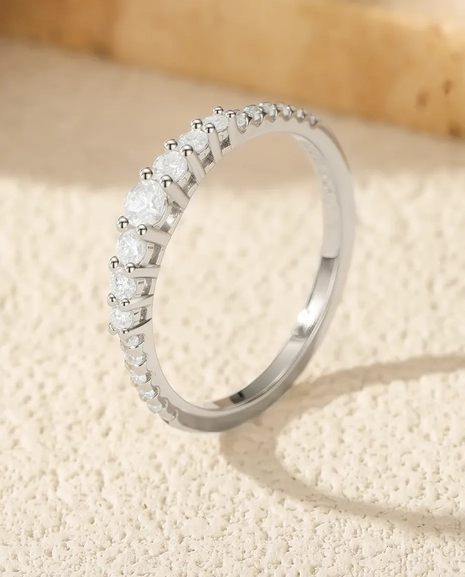 Graduated moissanite wedding band in 925 sterling silver with 19 round D color stones