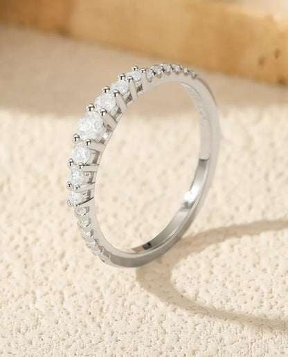 Graduated moissanite wedding band in 925 sterling silver with 19 round D color stones
