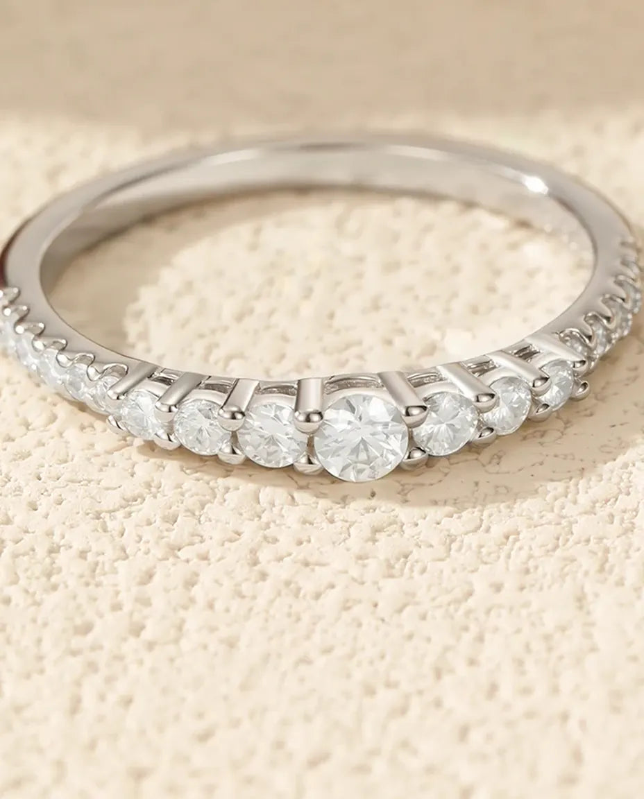 Graduated moissanite wedding band in 925 sterling silver with 19 round D color stones