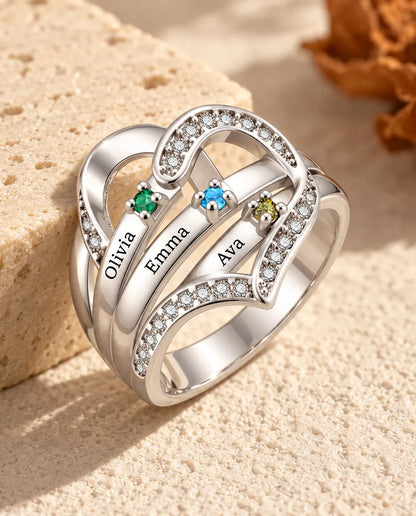 personalized heart birthstone ring with 3 engraved names and 3 prong set birthstones on polished ribbons, rhodium plated