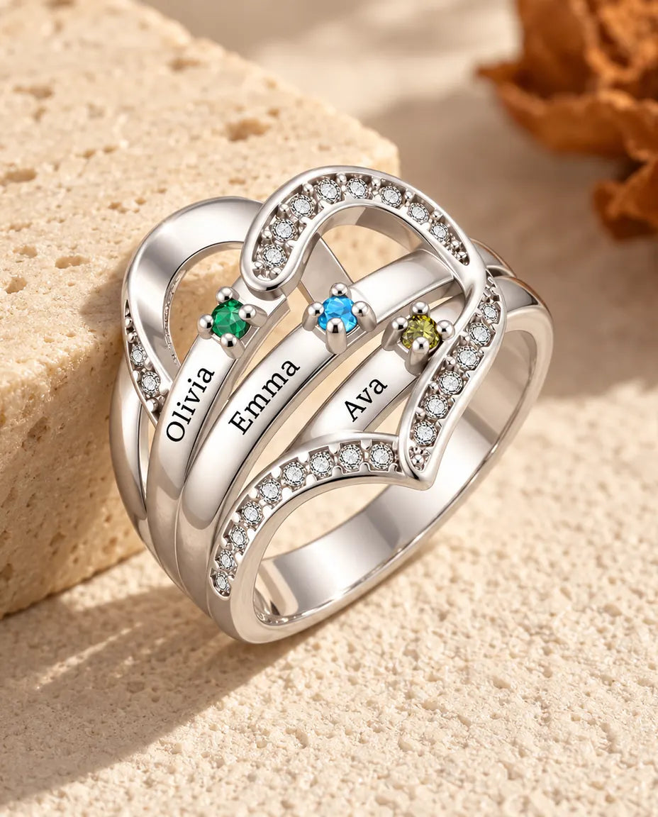 personalized heart birthstone ring with 3 engraved names and 3 prong set birthstones on polished ribbons, rhodium plated