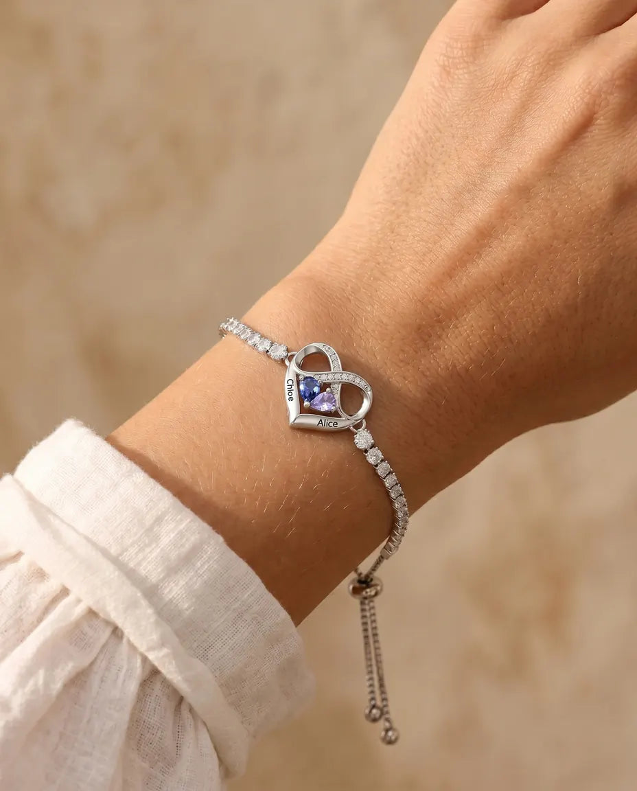 Infinity heart birthstone bracelet with engraved names, worn view