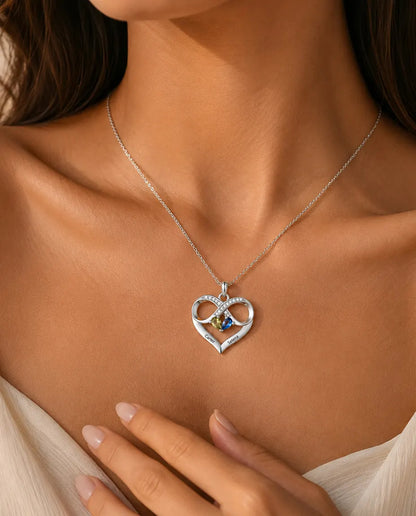 Woman wearing the personalized infinity heart birthstone necklace