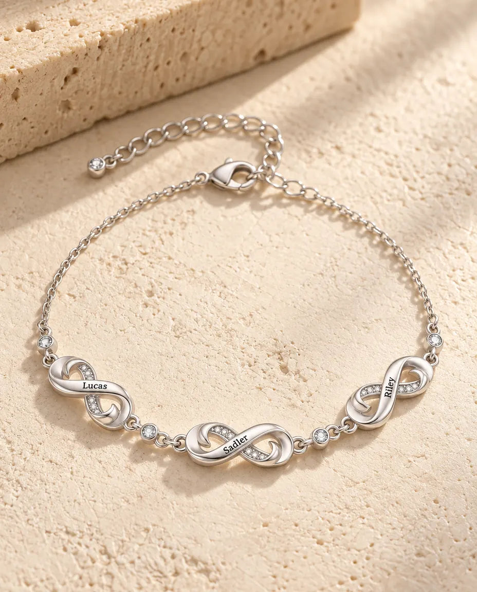 Personalized infinity name bracelet with three engraved infinity charms and cubic zirconia